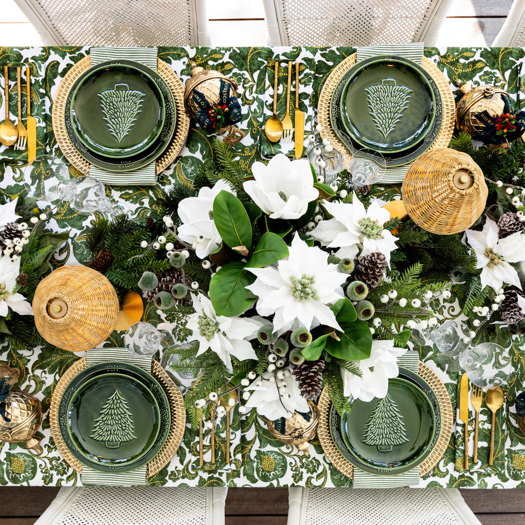 Overhead shot of a table set with the Batik Verdigris Christmas Napery Collection.