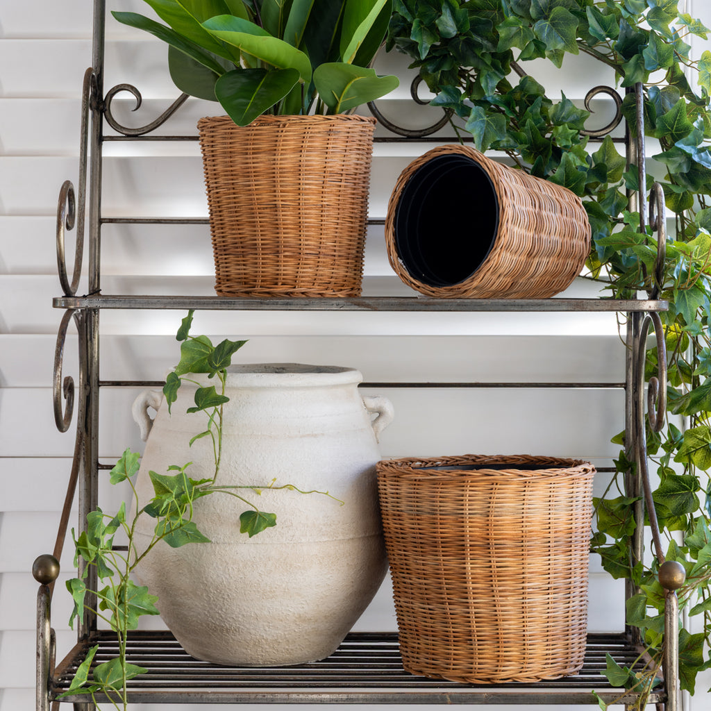 Rattan Dalat Waste Bins tyled on Shelf with Florals and Pot