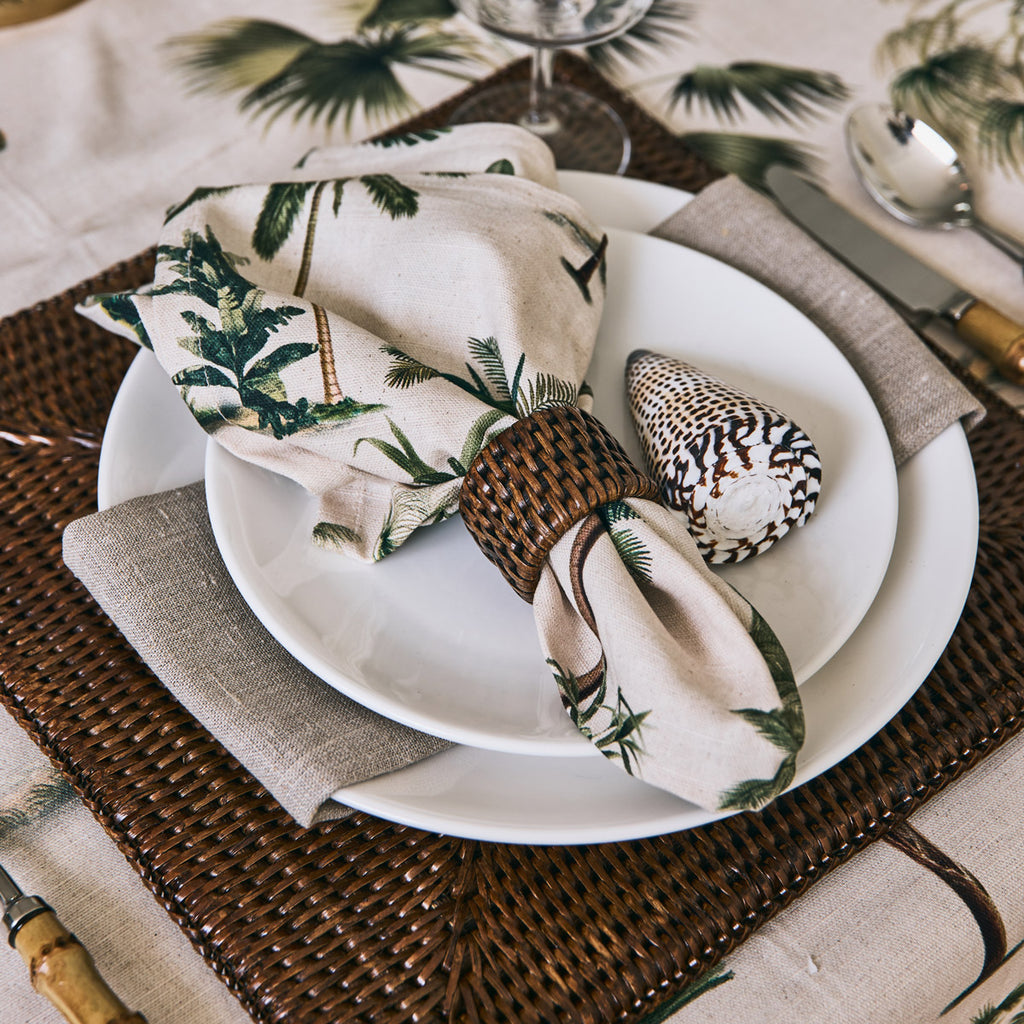 palm napkin on brown rattan placemat