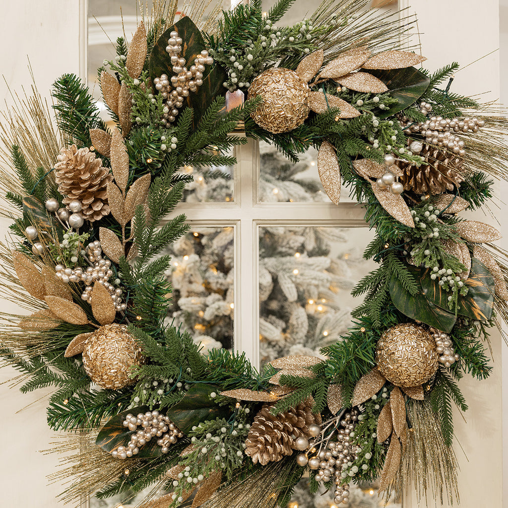 Champagne glitter and green wreath.