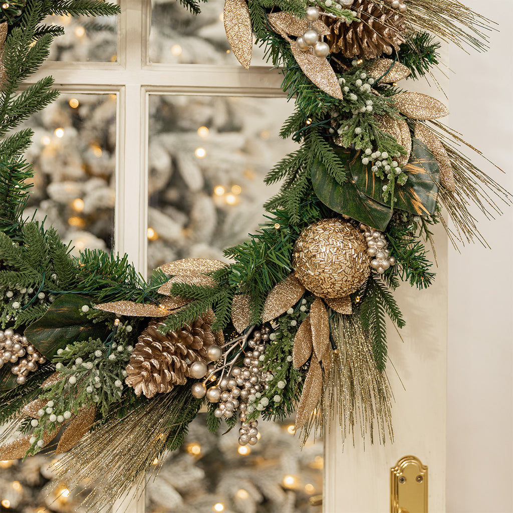 Champagne glitter and green wreath.