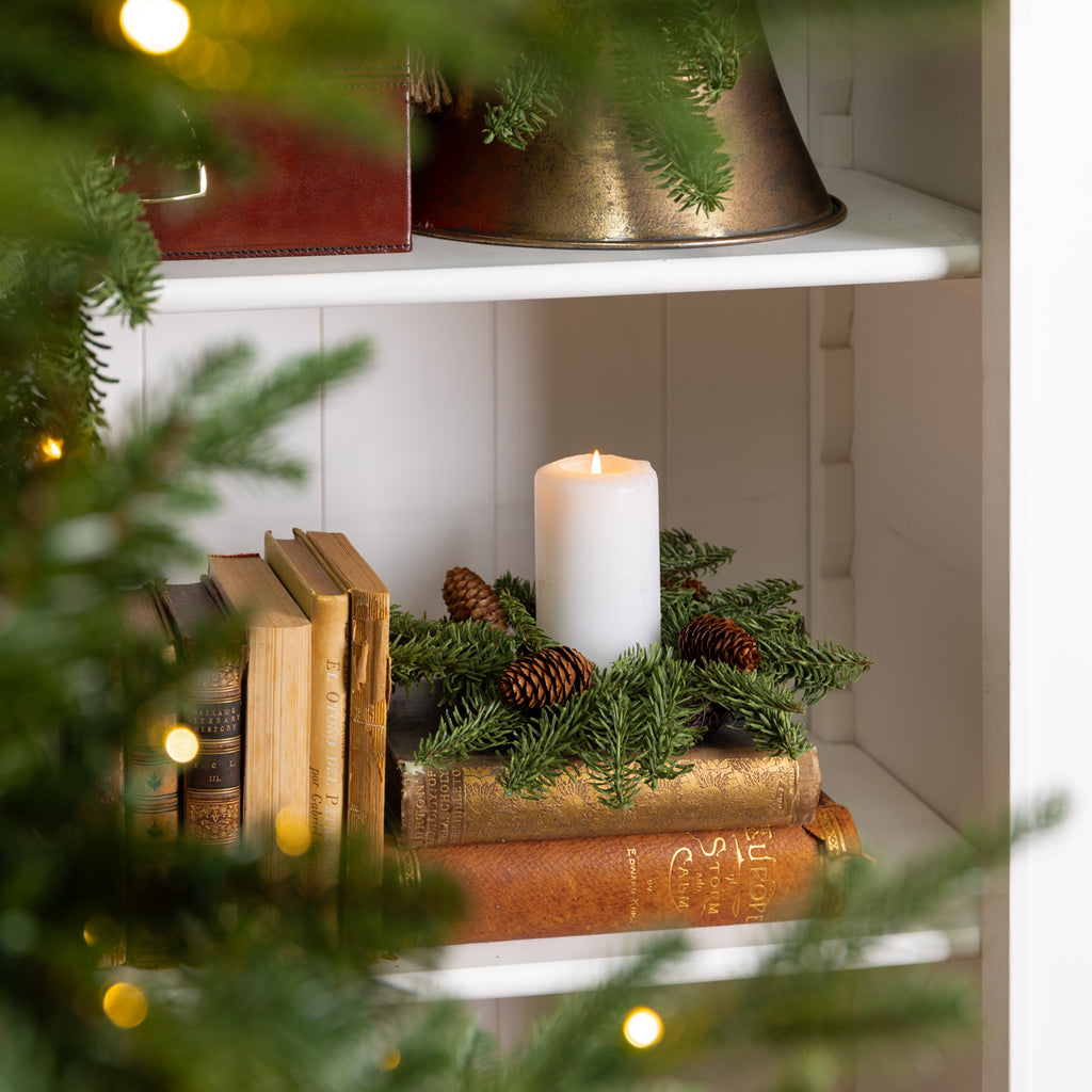 Spruce Pinecone Candle Rings Styled on Bookcase