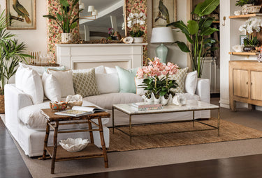 Tropical style living room with white linen sofa.