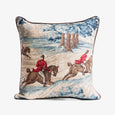 Decorative pillow with tapestry design of people on horseback in a landscape.