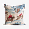 Decorative pillow with tapestry design of people on horseback in a landscape.