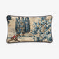 Decorative pillow with a landscape design featuring a person on horseback and trees.