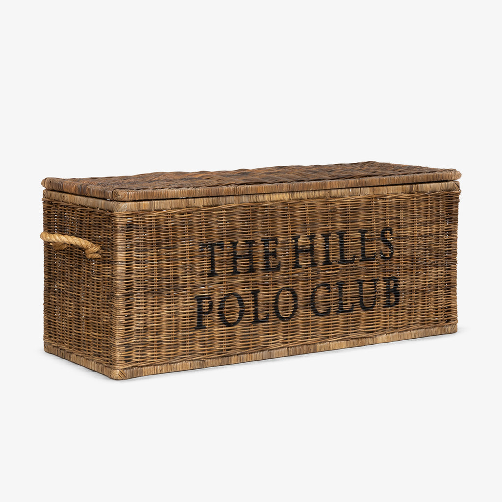 Wicker storage chest with 'The Hills Polo Club' text on a white background