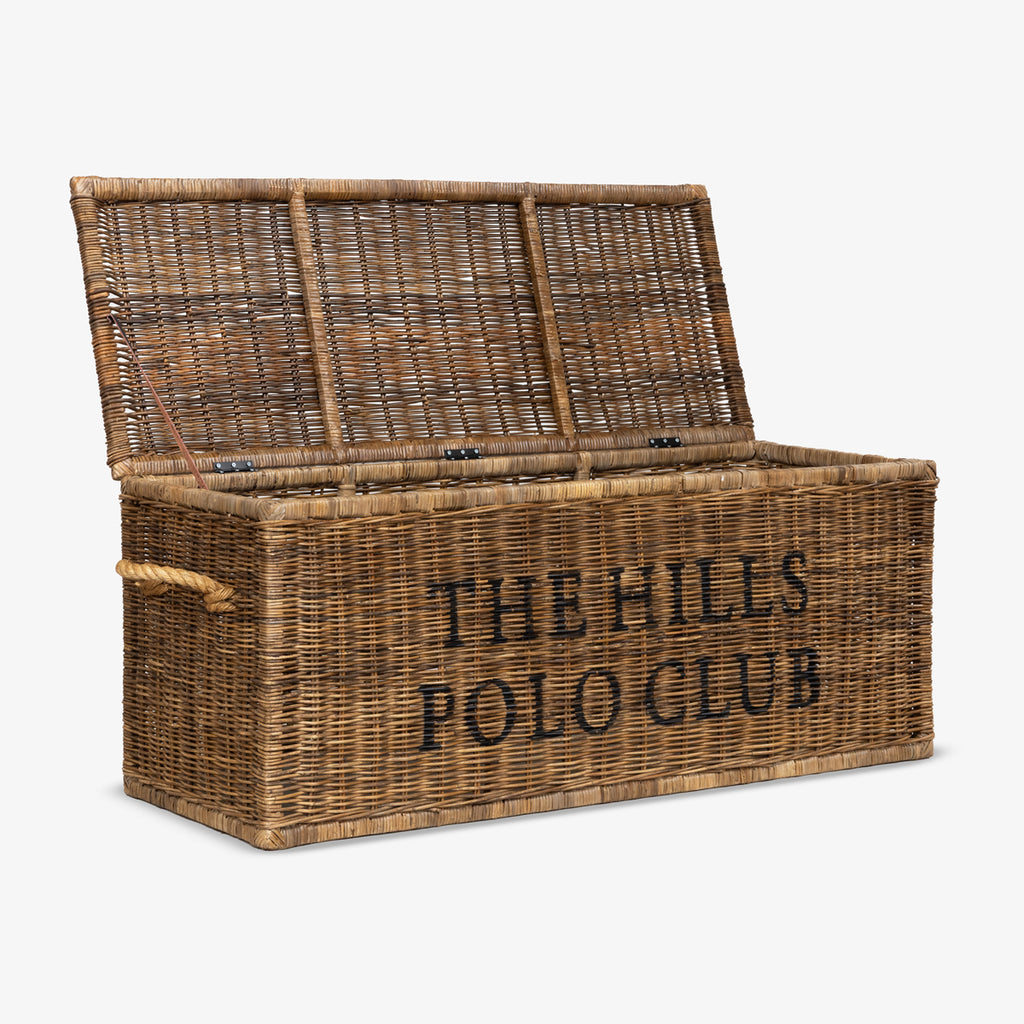 Wicker storage chest with 'The Hills Polo Club' text on a white background open.