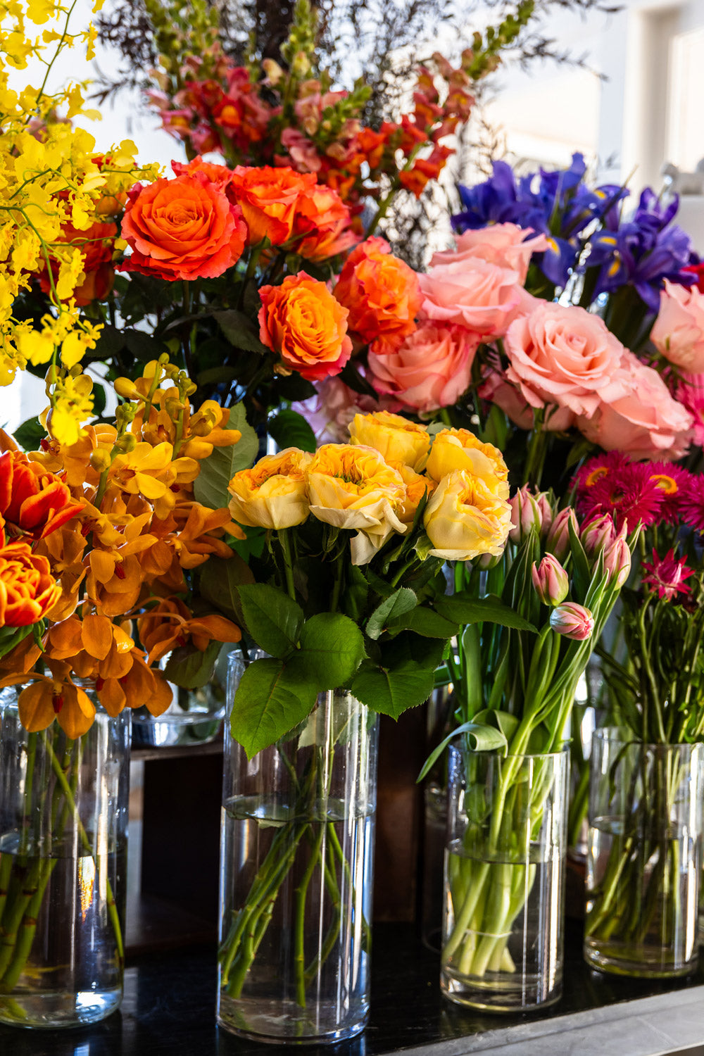 Close up of roses in glass vases at The Flower House Collaroy