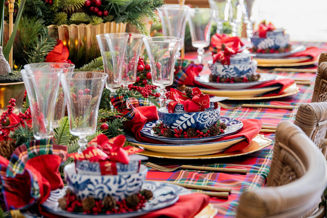 Blue & white dinnerware on a tartan tablecloth for Christmas.