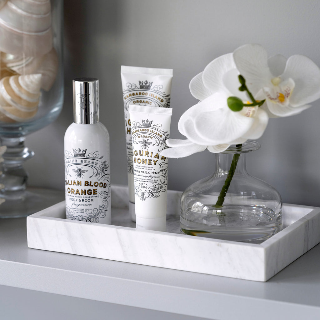 Ligurian Honey Hand & Nail Creme Styled On Commo Tray