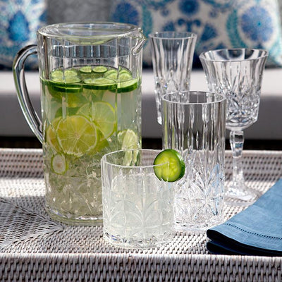 Outdoor Crystal Jug Styled On White Rattan Tray